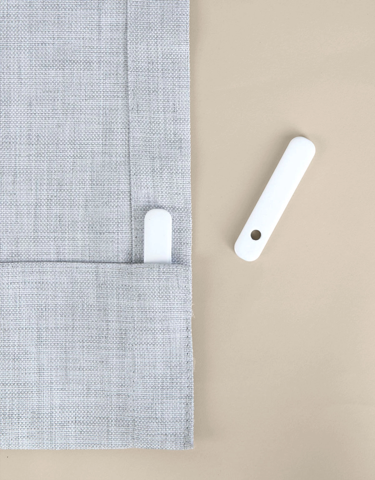 Gardintyngd i fållen på en gardin