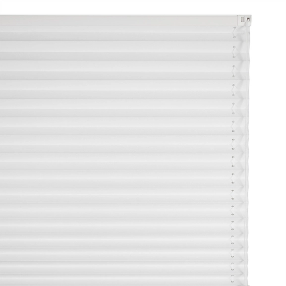 Närbild på mörkläggande plisségardin