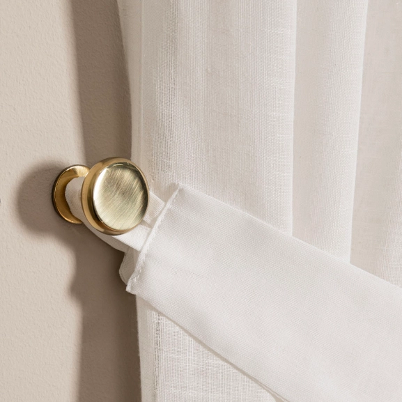 Omtagsfäste i polerad mässing